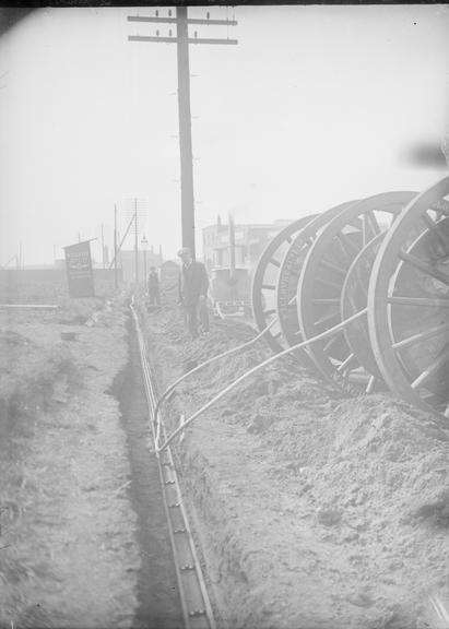 Works photographic negative of cable laying, Elevator Building