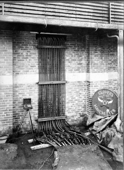 Works photographic negative of cables emerging from trench