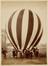 photograph: balloon before flight being held by young men and