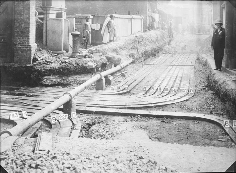 Works photographic negative of trench with troughing