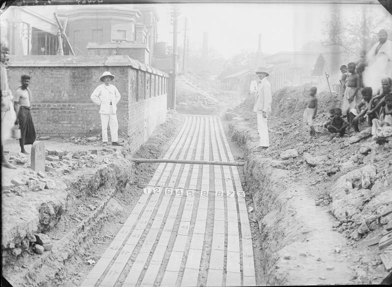 Works photographic negative of trench with troughing