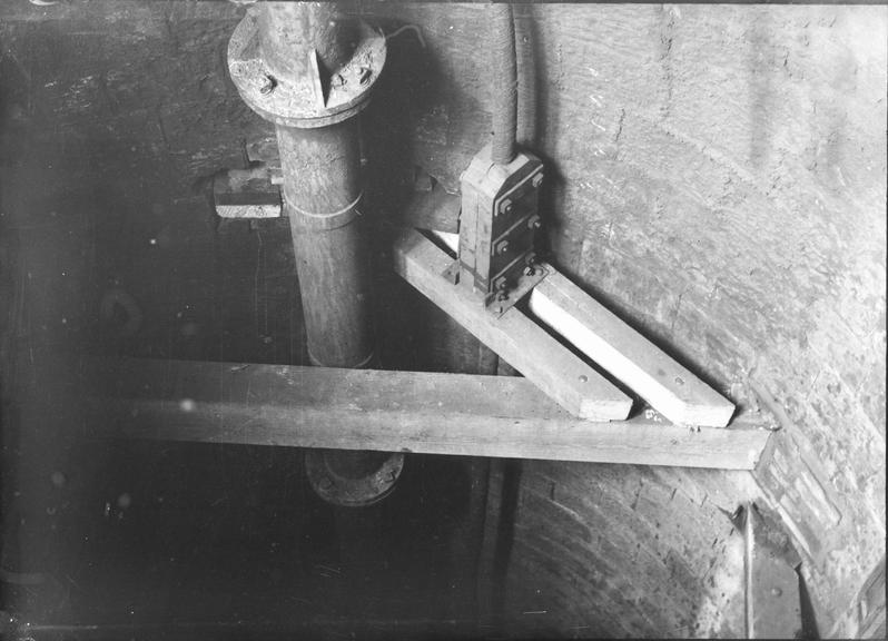 Works photographic negative of cable in mine shaft