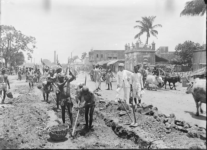 Works photographic negative of local men digging trench