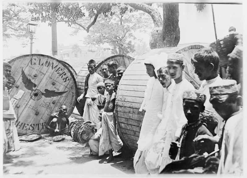 Works photographic negative of locals with cable drums