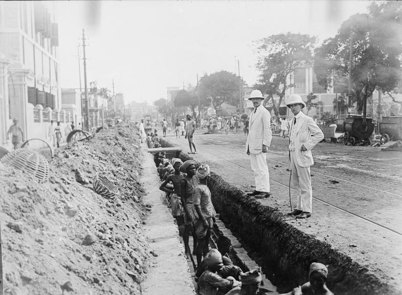 Works photographic negative of men in trench