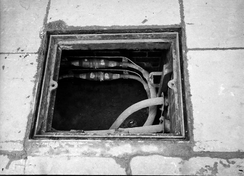 Works photographic negative of jointed cables in manhole, Wigan