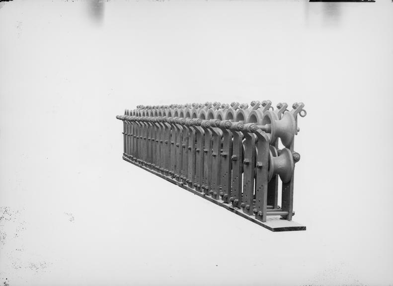 Works photographic negative of row of pulleys