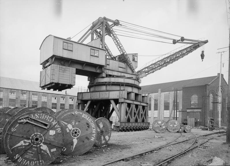 Works photographic negative of rail-mounted crane