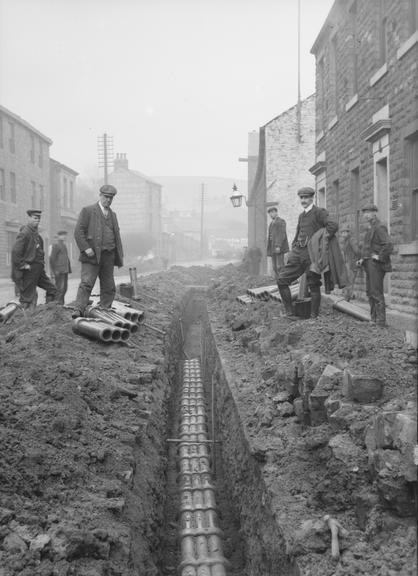 Works photographic negative of conduit in trench, Bacup