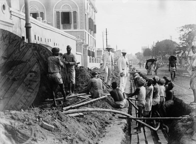 Works photographic negative of men in trench