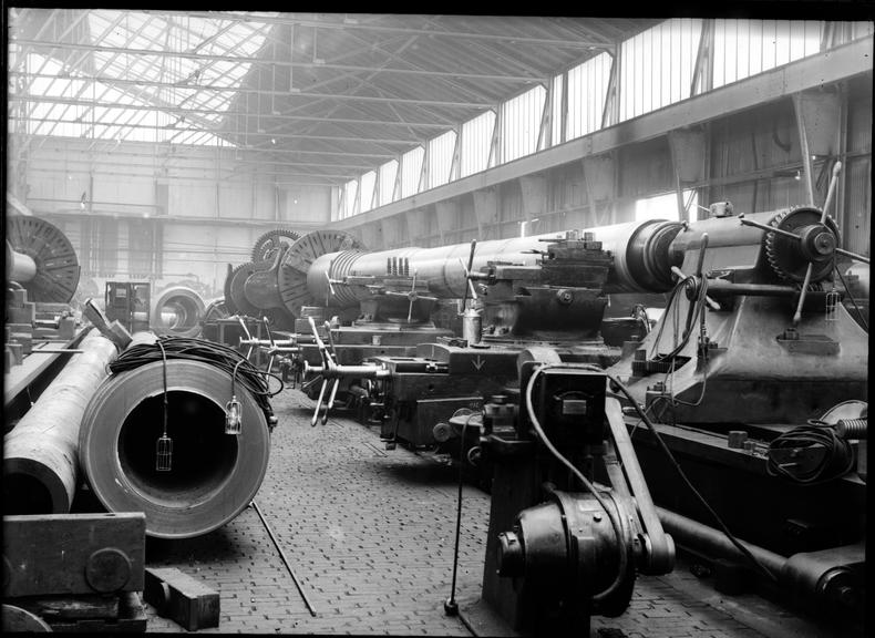 Works photographic negative of gun barrel on lathe