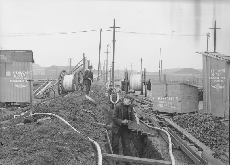 Works photographic negative of man sawing trough, Trafford Park