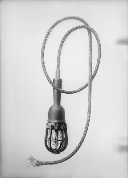 Works photographic negative of trailing cable with hand lamp