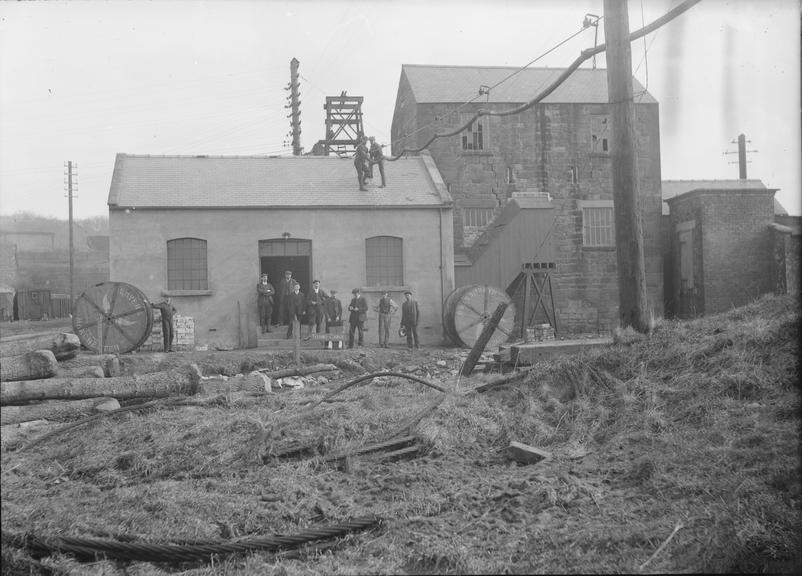 Works photographic negative of cable being slung over building