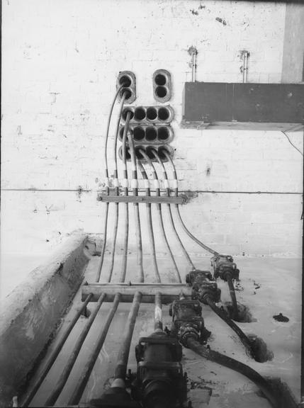 Works photographic negative of cables emerging from ceiling