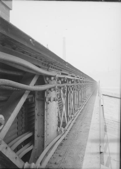 Works photographic negative of cables supported on brackets