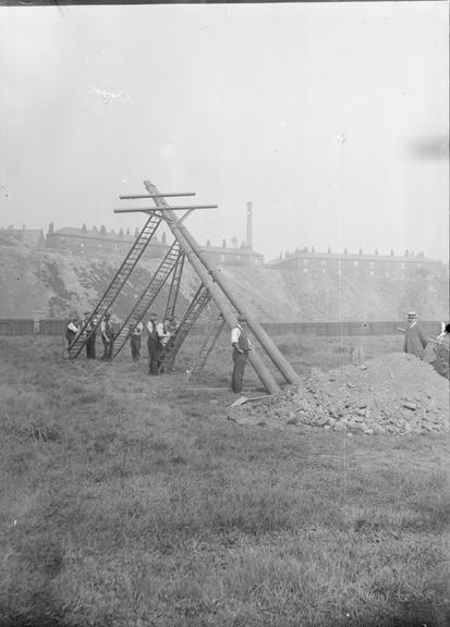 Works photographic negative of men raising column, Bury