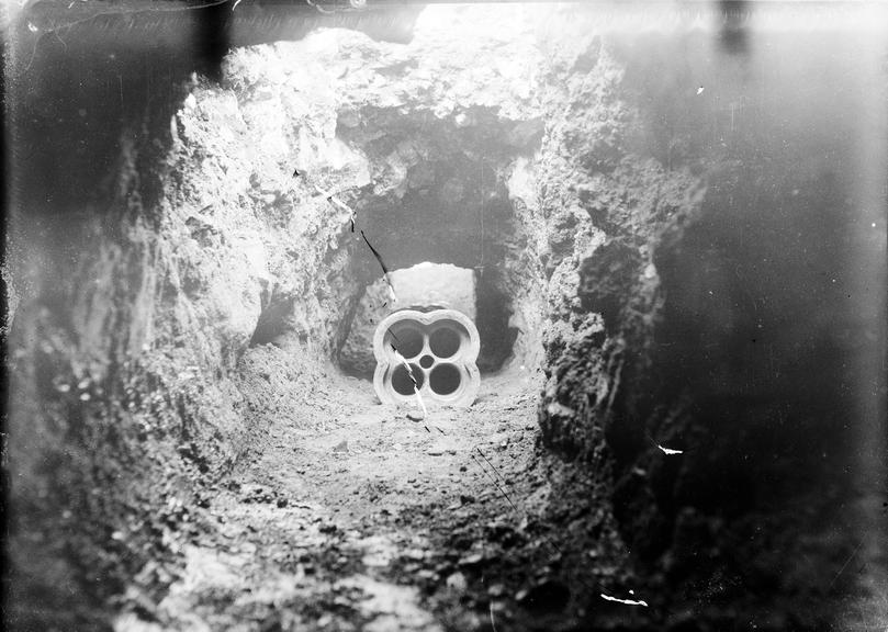 Works photographic negative of conduit in trench