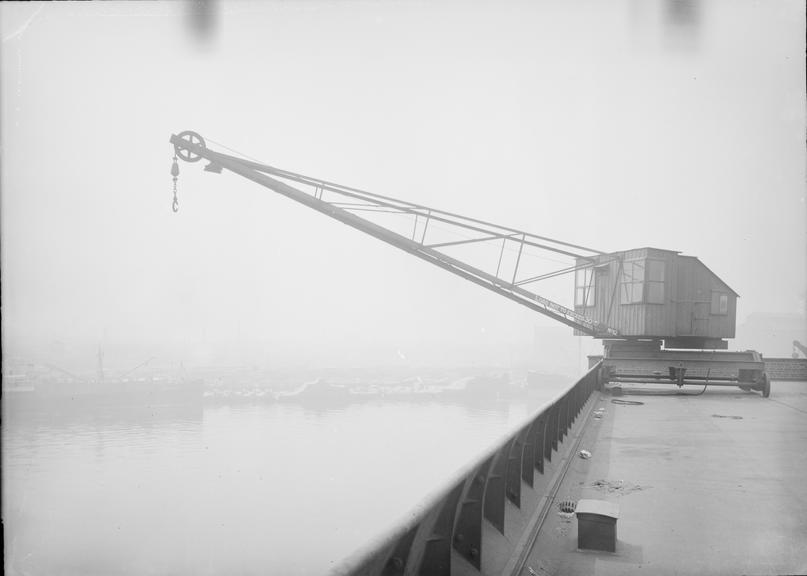 Works photographic negative of wharf-side crane