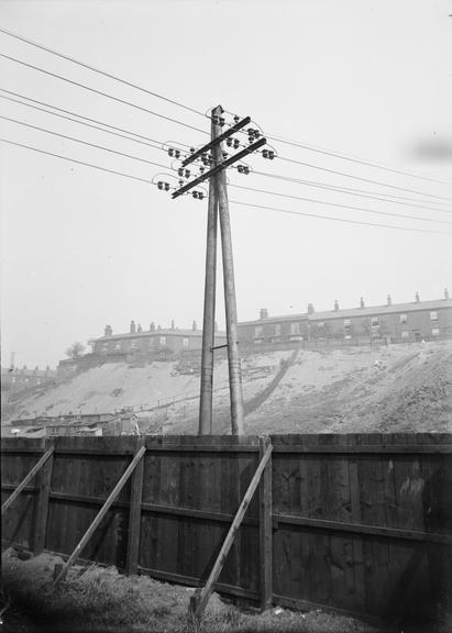 Works photographic negative of overhead cables and column