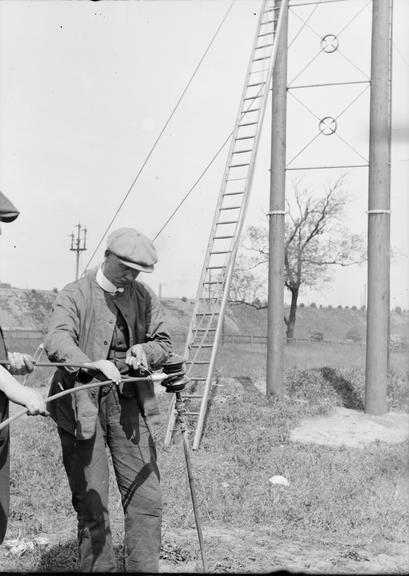 Works photographic negative of man making connection to