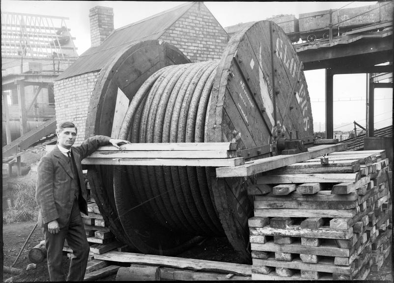 Works photographic negative of cable drum on timber stacks