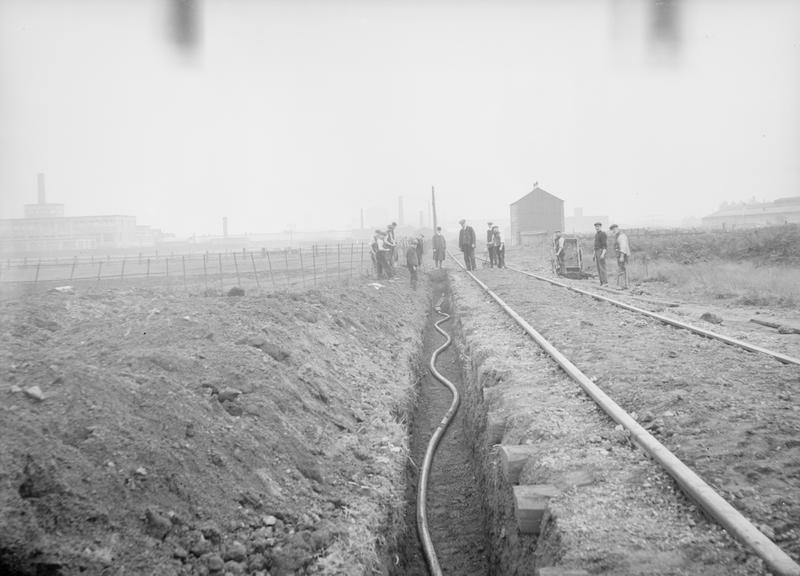 Works photographic negative of trench beside railway