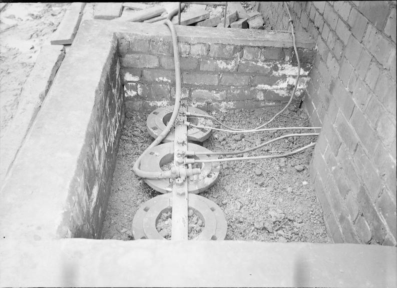 Works photographic negative of connections in pit