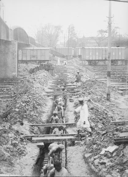 Works photographic negative of men working in trench