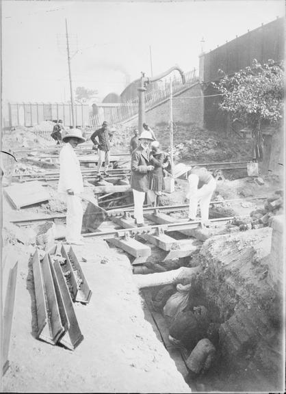 Works photographic negative of men working in trench