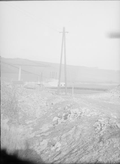 Works photographic negative of transmission lines across quarry