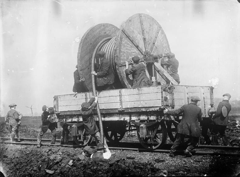 Works photographic negative of cable drum on railway wagon