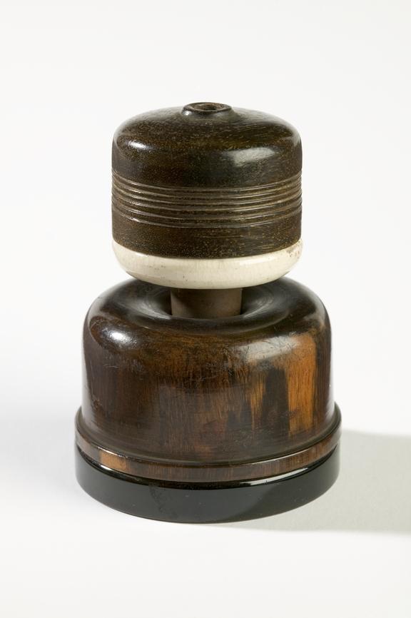 Electric plug,  c.1920.
Photographed on a white background.