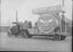 Works photographic negative of cable drum on parade float