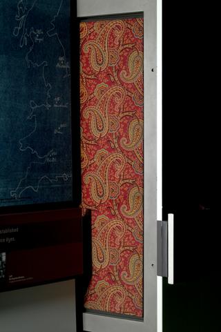 Sample of rectangular fabric with paisley design in blue