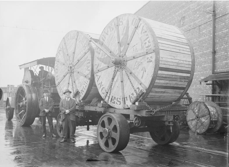 Works photographic negative of cable drums on trailer