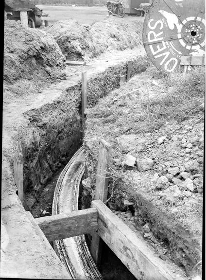 Works photographic negative of cable in trench, Trafford Park