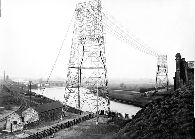 Works photographic negative of gantries beside railway bridge