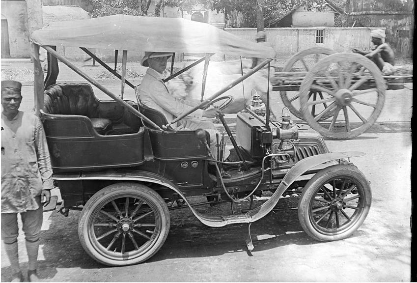 Works photographic negative of motor car with driver, possibly Calcutta (Kolkata), India