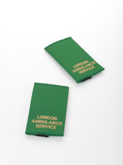 Green "London Ambulance Service" epaulets