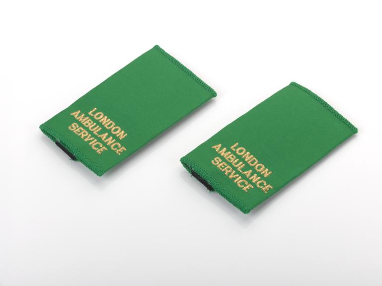 Green "London Ambulance Service" epaulets