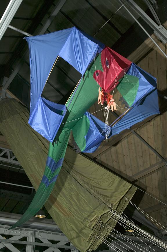 Hand held kite in the shape of a dragon