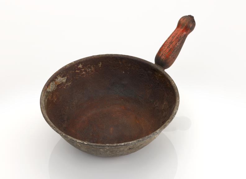 Water bail, metal/wooden handle, used in a public bathhouse.