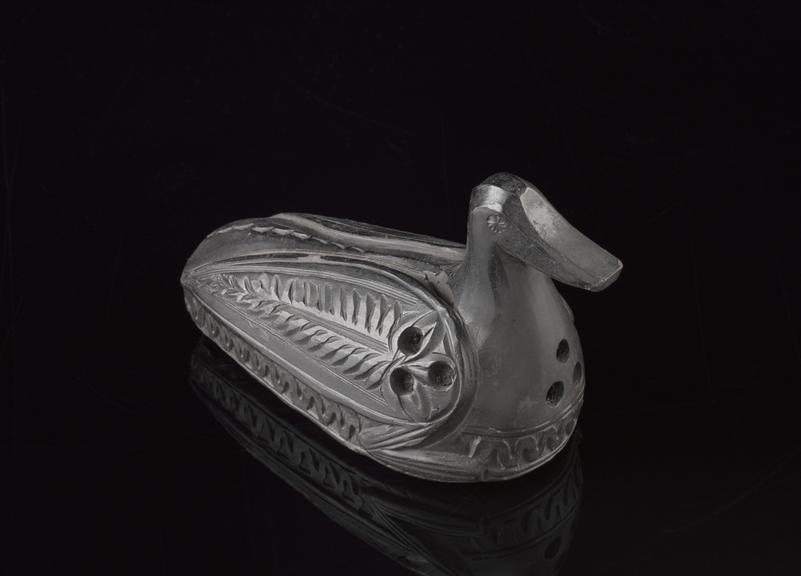 Earthenware skin scraper in the form of a duck