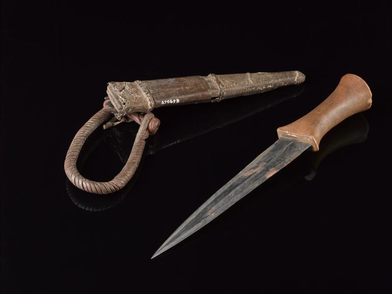 Steel bladed knife with wooden handle