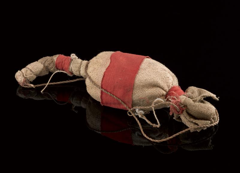 Medicine man's bag made of cloth with bound ends and fibre