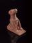 Brown earthenware foot scraper in the form of a seated dog