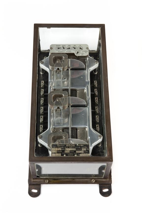 Electric meter; contained in steel framed glass case