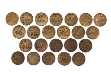 23 circular brass parcel tokens. All are marked with 'PARCELS DEPT. VICTORIA' on the obverese