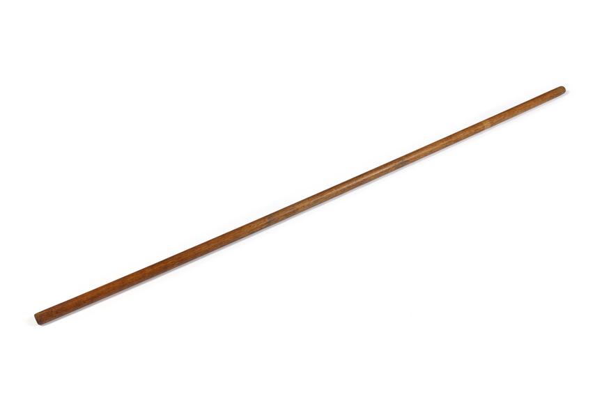 Wooden stemming rod.
Photographed on a white background.